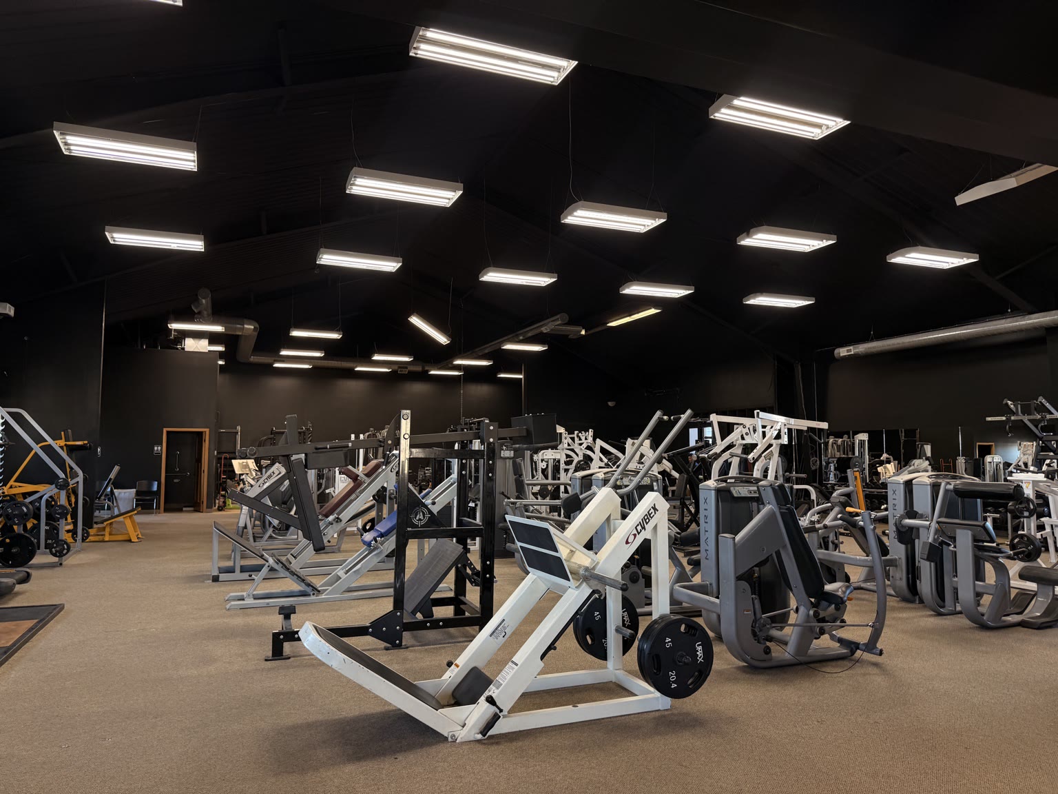 Wide view of strength equipment inside Ace Athletics Gym